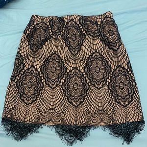nude and black lace mini skirt